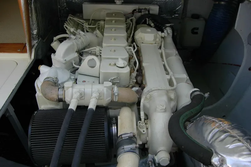 Slide: The Image of Engine compartment of a 1987 Bertram 33 Sport Fisherman boat, showcasing detailed components. - 46
