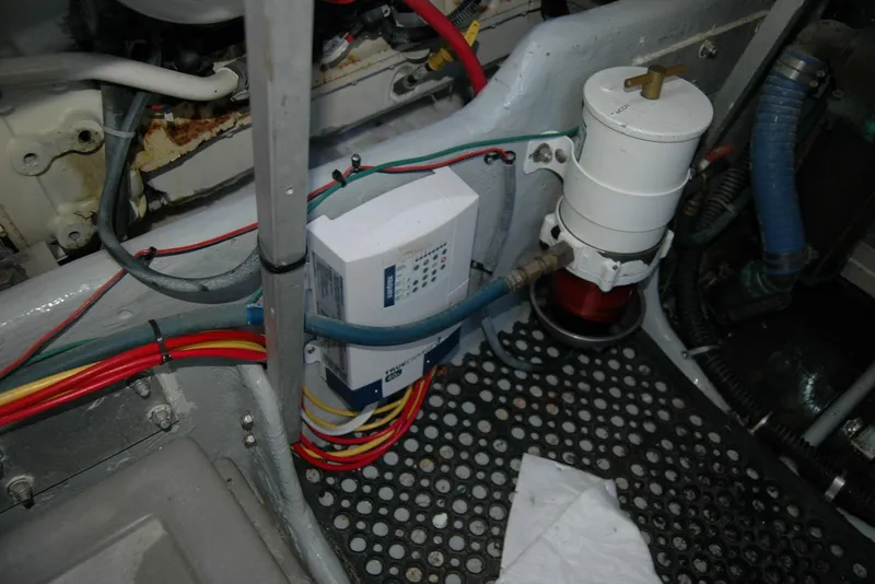 Slide: The Image of Engine room of 1987 Bertram 33 Sport Fisherman with wiring and filter system. - 53