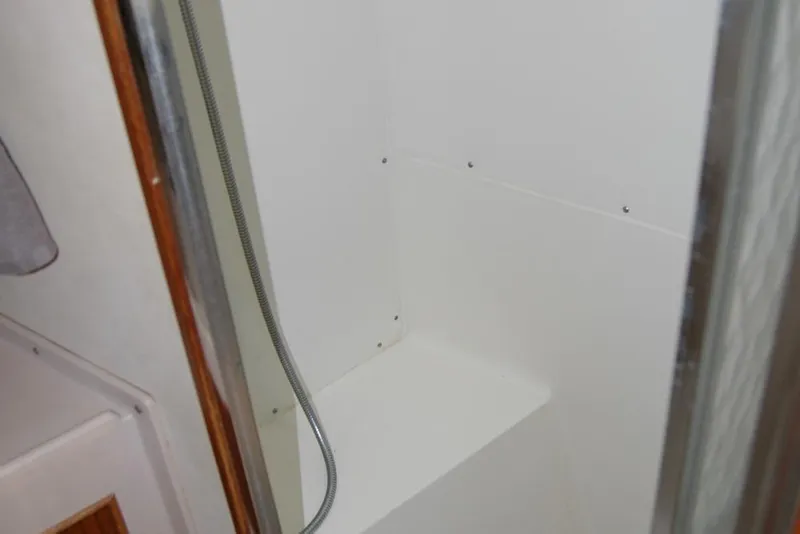 Slide: The Image of Shower area inside 1987 Bertram 33 Sport Fisherman boat. - 77