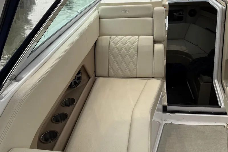 Slide: The Image of Luxurious interior seating of 2020 Regal 28 Express boat with beige upholstery. - 13