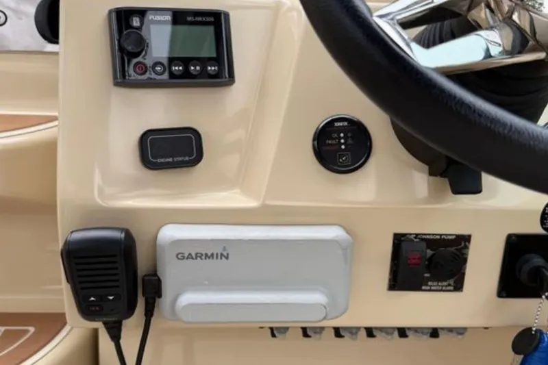 Slide: The Image of Control panel of 2020 Regal 28 Express boat with Garmin and Fusion devices. - 20