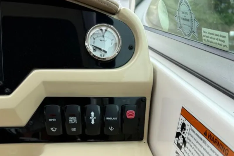 Slide: The Image of Control panel of 2020 Regal 28 Express boat with fuel gauge and switches. - 21