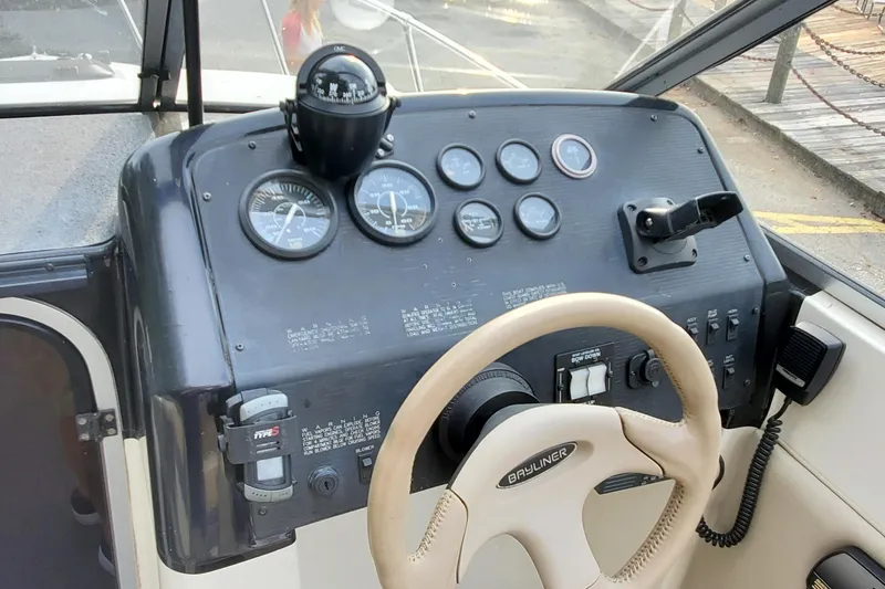 Slide: The Image of 1996 Bayliner 2252 Ciera Express dashboard with steering wheel and instrument panel. - 19