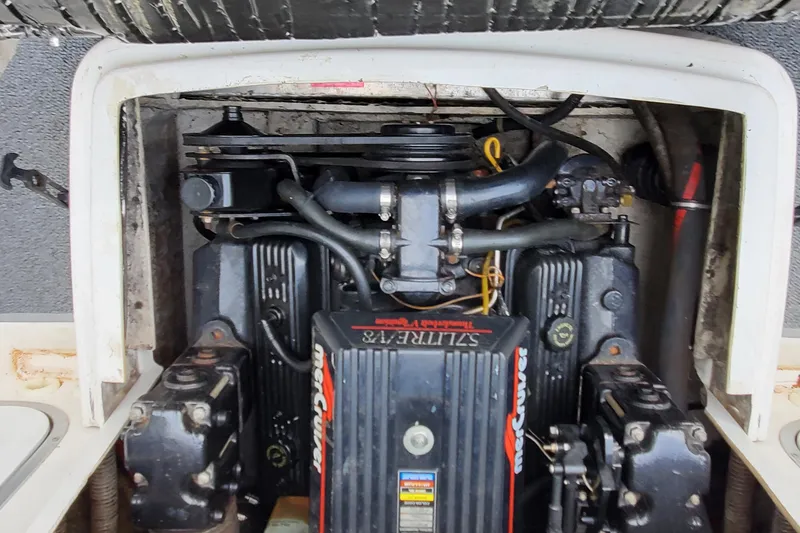 Slide: The Image of Engine compartment of a 1996 Bayliner 2252 Ciera Express boat, featuring a MerCruiser engine. - 20
