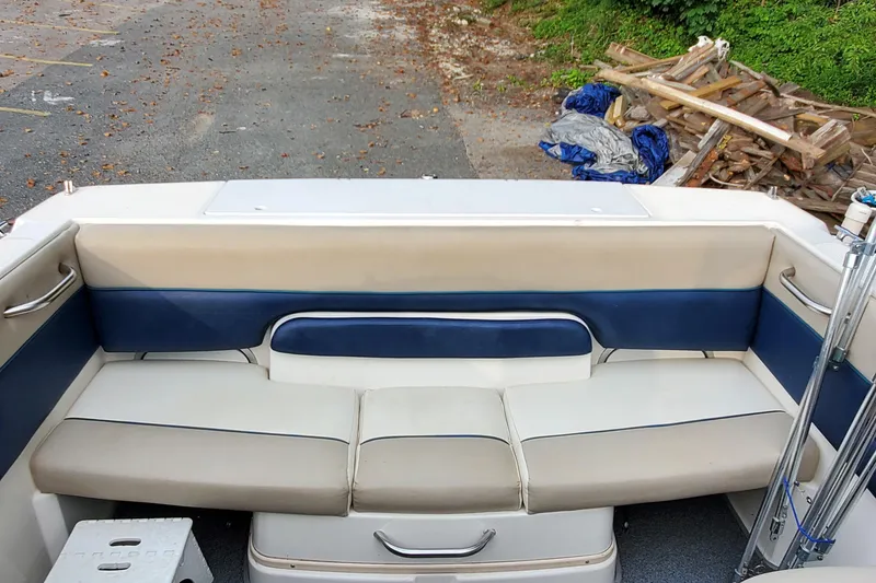 Slide: The Image of 1996 Bayliner 2252 Ciera Express boat interior with beige and blue seating. - 27