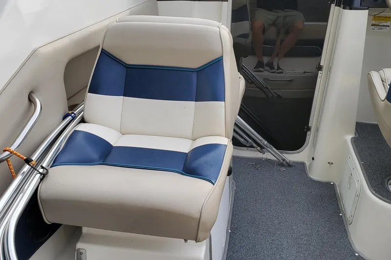 Slide: The Image of 1996 Bayliner 2252 Ciera Express interior with blue and white seating. - 36