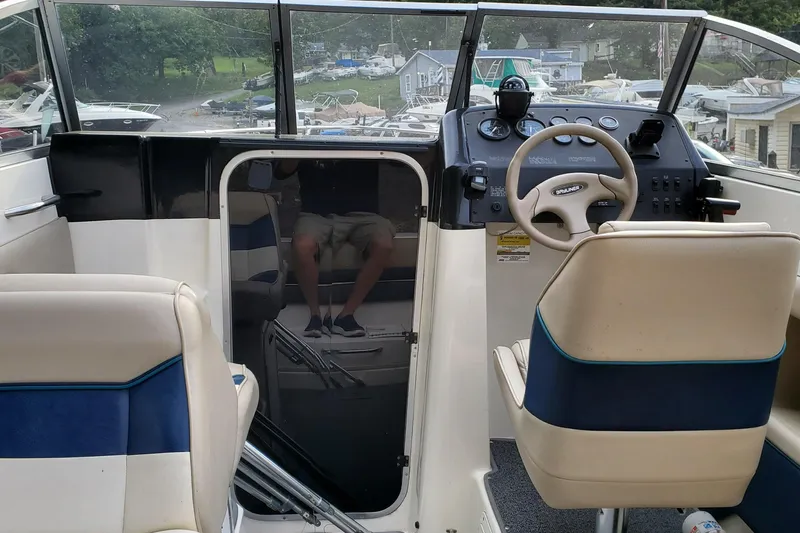 Slide: The Image of 1996 Bayliner 2252 Ciera Express boat interior with steering wheel and seating. - 37