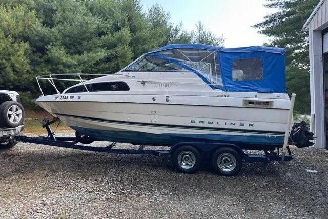 Slide: The Image of 1996 Bayliner 2252 Ciera Express boat on trailer, parked outdoors near trees. - 40