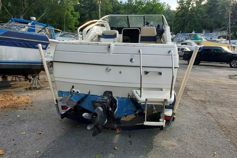Slide: The Image of 1996 Bayliner 2252 Ciera Express boat, rear view, parked on a trailer. - 8