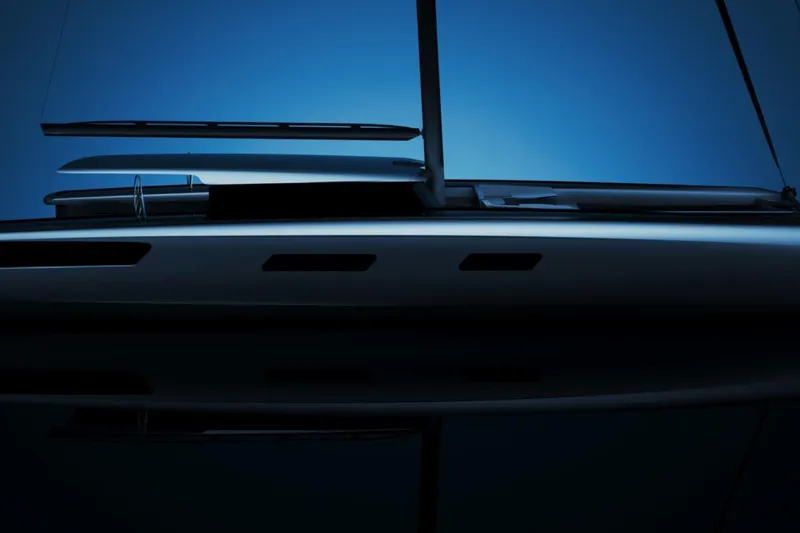 Slide: The Image of Sleek Black Pepper Code C.100 yacht silhouette against a deep blue sky, 2027 model. - 3