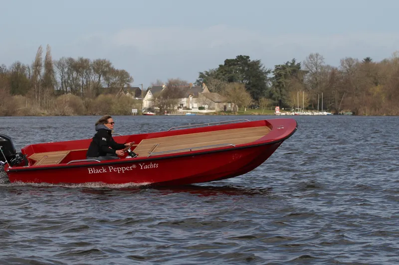 Slide: The Image of Red Black Pepper tender 17 boat cruising on a lake, 2026 model. - 13