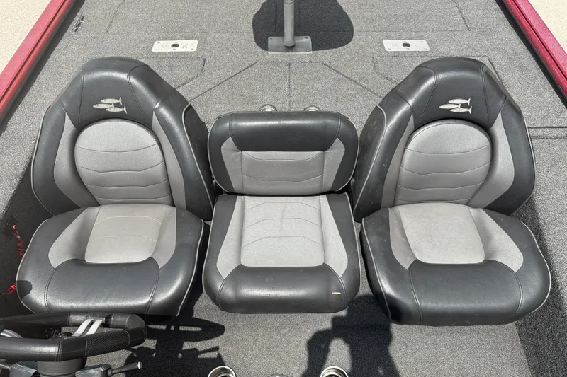 Slide: The Image of Three black and gray seats on a 2021 SeaArk BC 210 boat deck. - 10