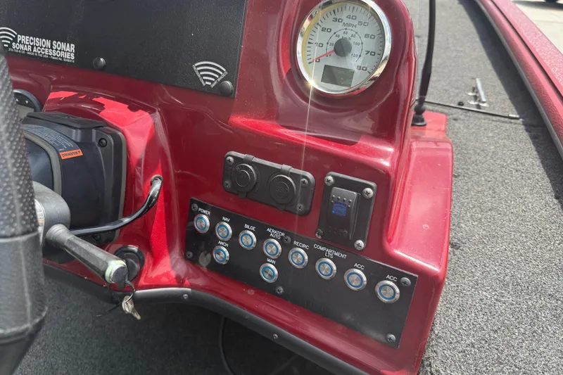 Slide: The Image of Dashboard of a 2021 SeaArk BC 210 boat with speedometer and control panel. - 12