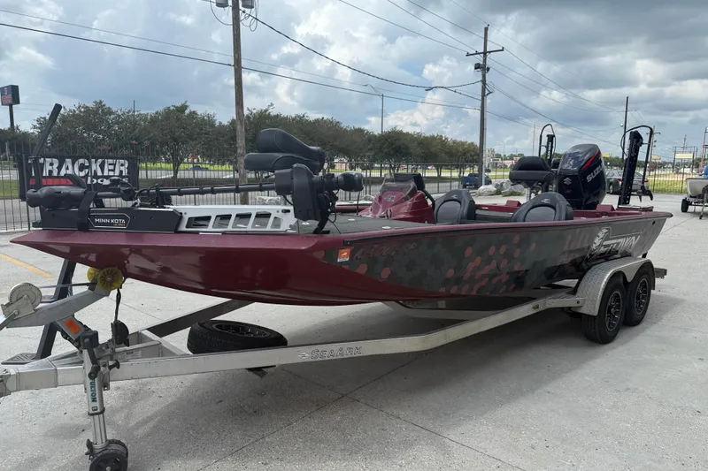 Slide: The Image of 2021 SeaArk BC 210 boat on trailer, featuring Minn Kota trolling motor. - 3
