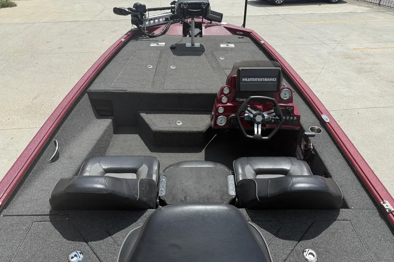 Slide: The Image of 2021 SeaArk BC 210 boat interior with steering console and seating. - 7