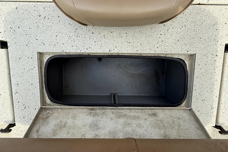 Slide: The Image of Storage compartment in 2020 Xpress H20B boat with speckled interior design. - 12