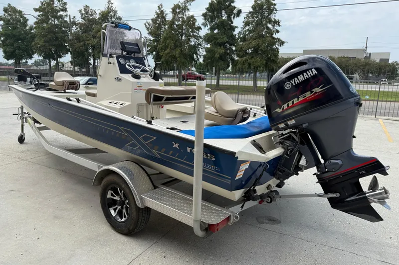 Slide: The Image of 2020 Xpress H20B boat with Yamaha outboard motor on a trailer. - 4