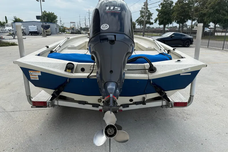 Slide: The Image of 2020 Xpress H20B boat with outboard motor on trailer, parked outdoors. - 5