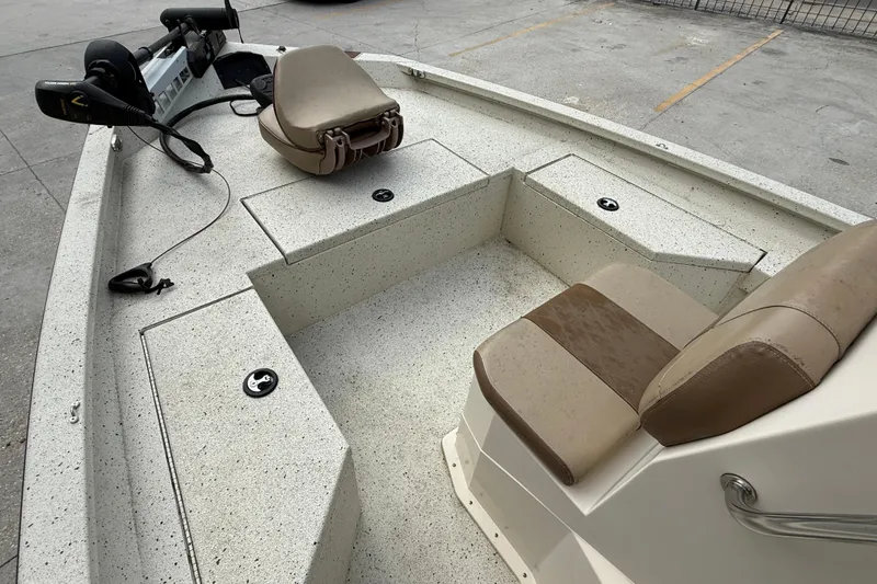 Slide: The Image of 2020 Xpress H20B boat interior with seating and storage compartments. - 9