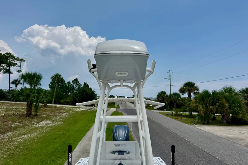 Slide: The Image of 2023 Pathfinder 2500 Hybrid boat on road, surrounded by palm trees and blue sky. - 15