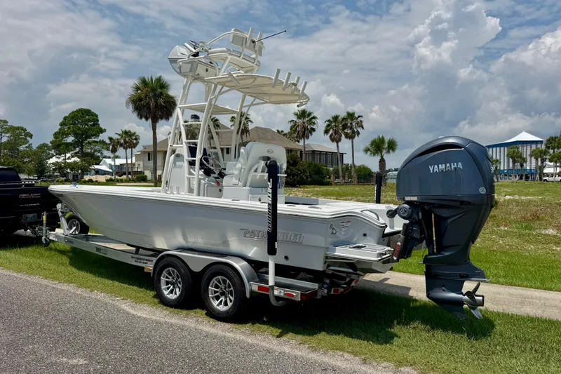 Slide: The Image of 2023 Pathfinder 2500 Hybrid boat with Yamaha engine on trailer, parked outdoors. - 3