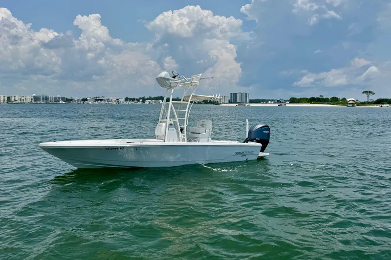 Slide: The Image of 2023 Pathfinder 2500 Hybrid boat on water with cloudy sky background. - 5