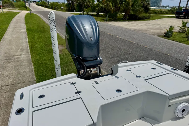 Slide: The Image of 2023 Pathfinder 2500 Hybrid boat with Yamaha outboard motor on a sunny day. - 7