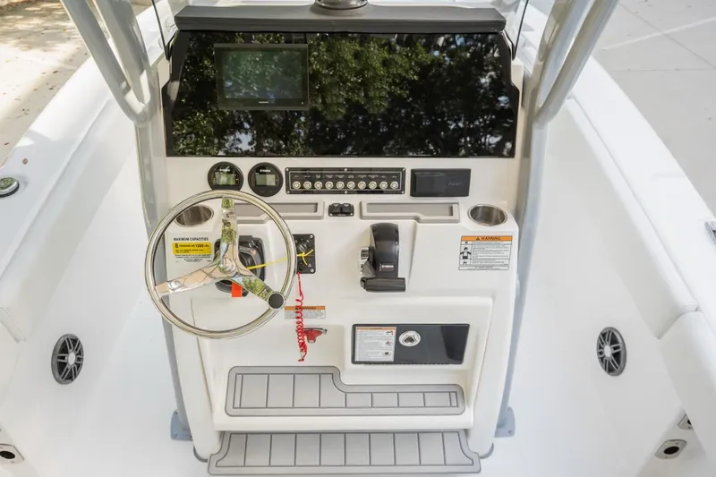 Slide: The Image of 2025 Sea Fox 228 Commander boat console with steering wheel and controls. - 15