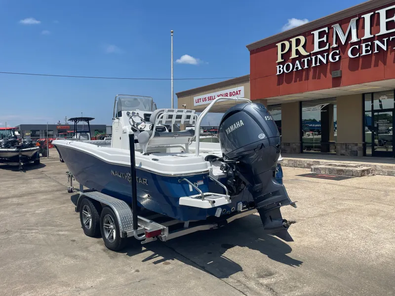 Slide: The Image of 2024 NauticStar 211 Hybrid boat with Yamaha engine at Premier Boating Center. - 10