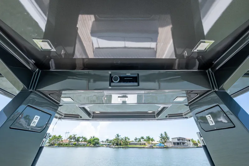 Slide: The Image of 2023 Schaefer V33 boat interior with modern ceiling design and waterfront view. - 13