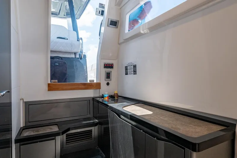 Slide: The Image of 2023 Schaefer V33 yacht interior with modern design and sleek cabinetry. - 27