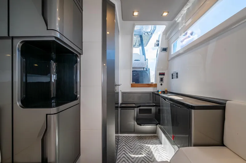 Slide: The Image of Modern interior of 2023 Schaefer V33 yacht with sleek cabinetry and natural light. - 28