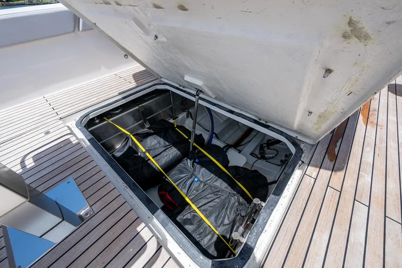 Slide: The Image of Open storage compartment on 2023 Schaefer V33 yacht deck. - 33