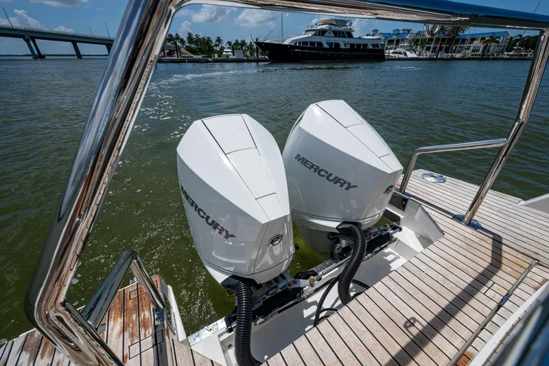 Slide: The Image of 2023 Schaefer V33 boat with dual Mercury outboard engines on a sunny day. - 34