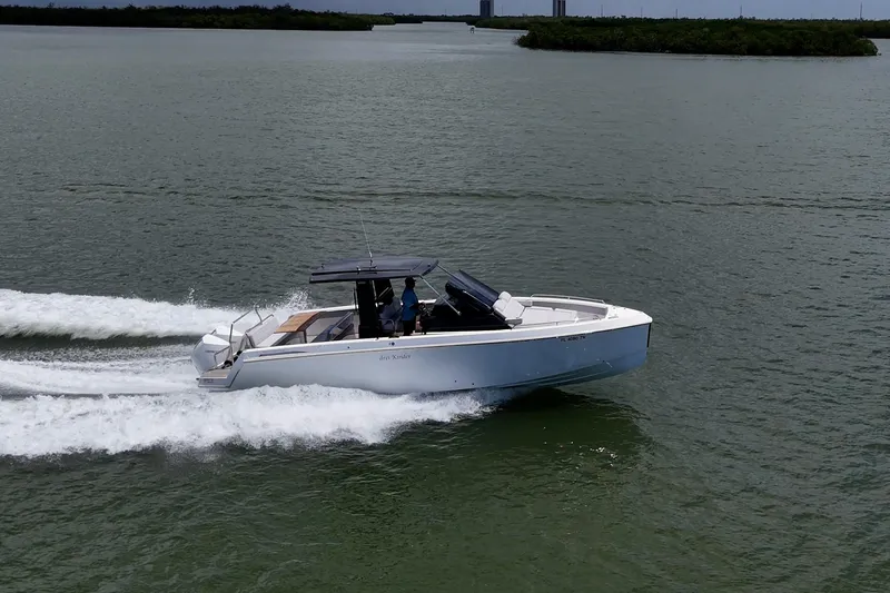 Slide: The Image of 2023 Schaefer V33 boat cruising on open water, side view. - 44
