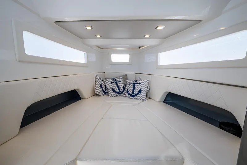 Slide: The Image of Luxurious interior of 2023 Schaefer V33 yacht with elegant seating and nautical-themed cushions. - 5
