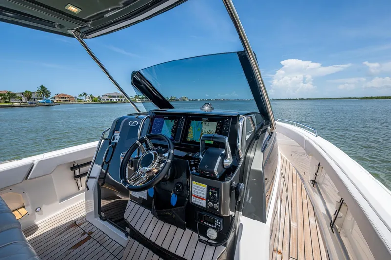 Slide: The Image of 2023 Schaefer V33 yacht helm with advanced navigation system on a sunny day. - 6