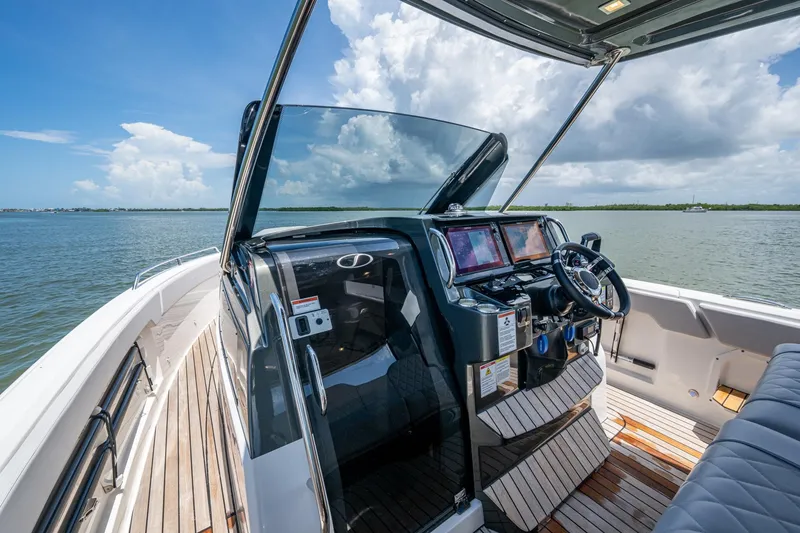 Slide: The Image of 2023 Schaefer V33 boat cockpit with modern controls on a sunny day. - 7