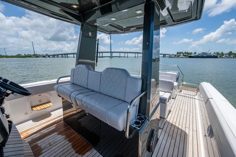 Slide: The Image of Luxurious 2023 Schaefer V33 yacht interior with elegant seating and scenic water view. - 8
