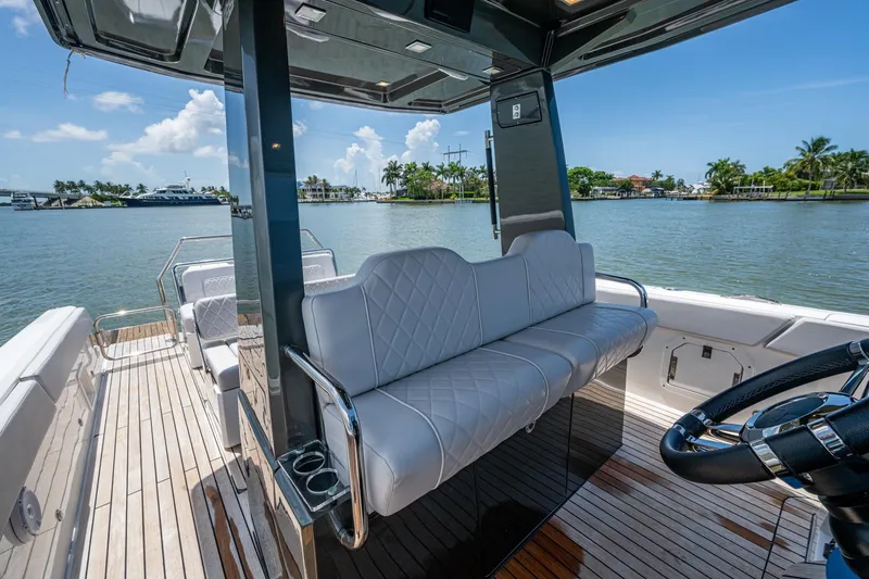 Slide: The Image of Luxurious 2023 Schaefer V33 yacht interior with elegant seating and scenic waterfront view. - 9