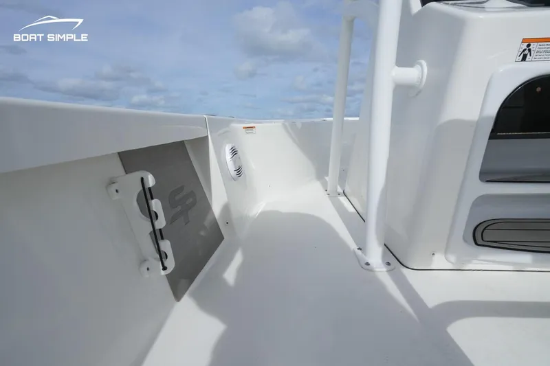 Slide: The Image of 2023 Sea Pro 208 Bay boat interior with sleek white design and modern features. - 10