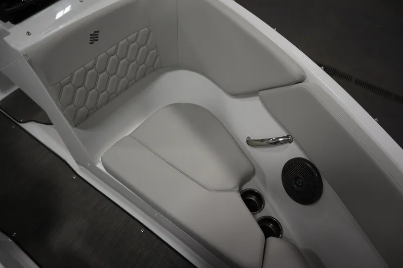 Slide: The Image of Interior seating of 2026 Four Winns H1 Freedom boat with modern design and cup holders. - 17