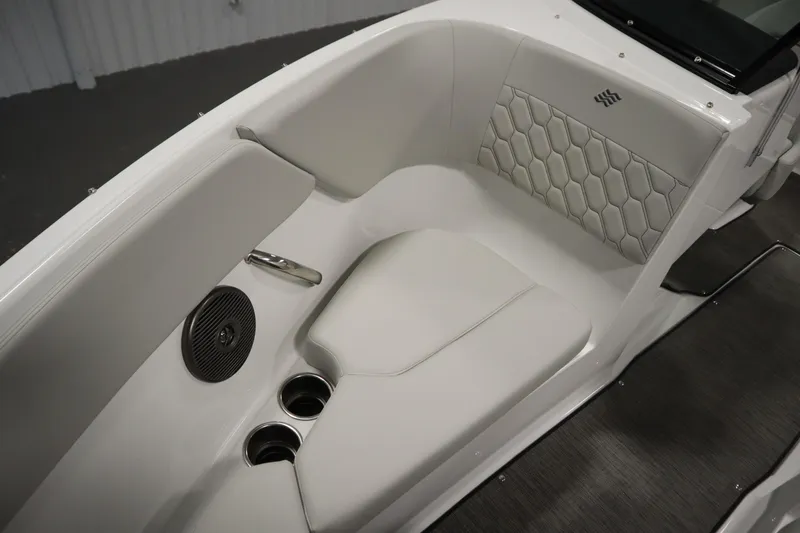 Slide: The Image of 2026 Four Winns H1 Freedom boat interior with white seating and cup holders. - 19