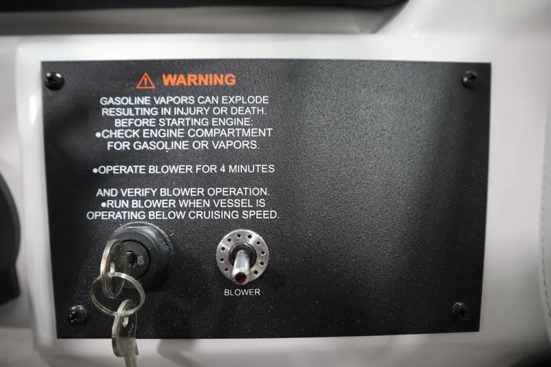 Slide: The Image of Warning label on 2026 Four Winns H1 Freedom boat, emphasizing gasoline vapor safety. - 27