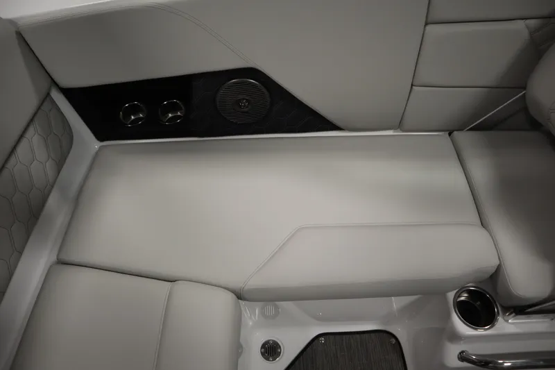 Slide: The Image of 2026 Four Winns H1 Freedom boat interior with gray seating and cup holders. - 40