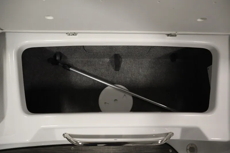 Slide: The Image of Storage compartment of 2026 Four Winns H1 Freedom boat with handle and cover. - 43