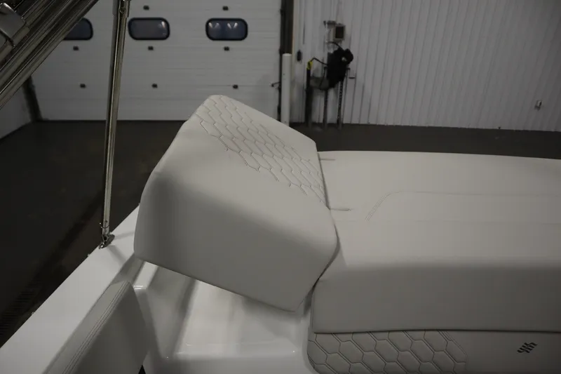 Slide: The Image of 2026 Four Winns H1 Freedom boat interior with white cushioned seating. - 50