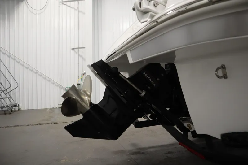 Slide: The Image of 2026 Four Winns H1 Freedom boat propeller and stern in a garage setting. - 56