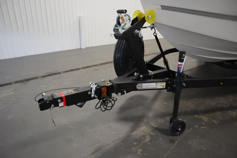 Slide: The Image of Trailer hitch of 2026 Four Winns H1 Freedom boat in a garage setting. - 57