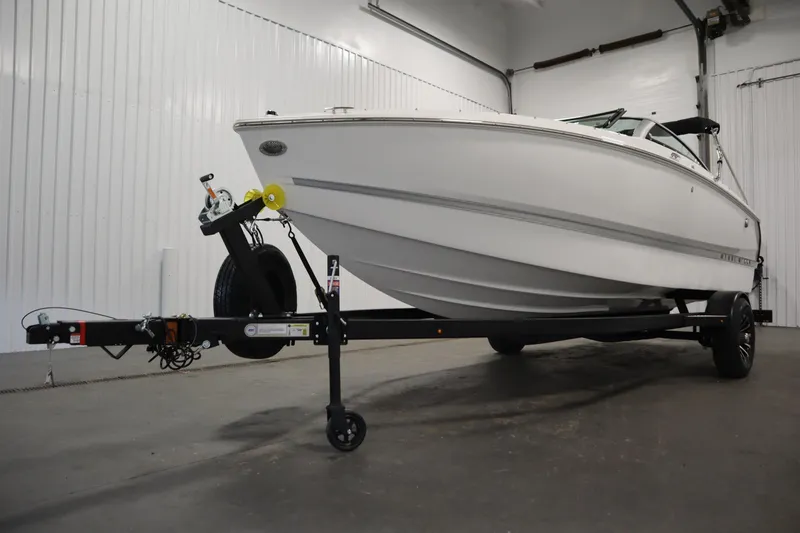 Slide: The Image of 2026 Four Winns H1 Freedom boat on trailer in indoor storage. - 59